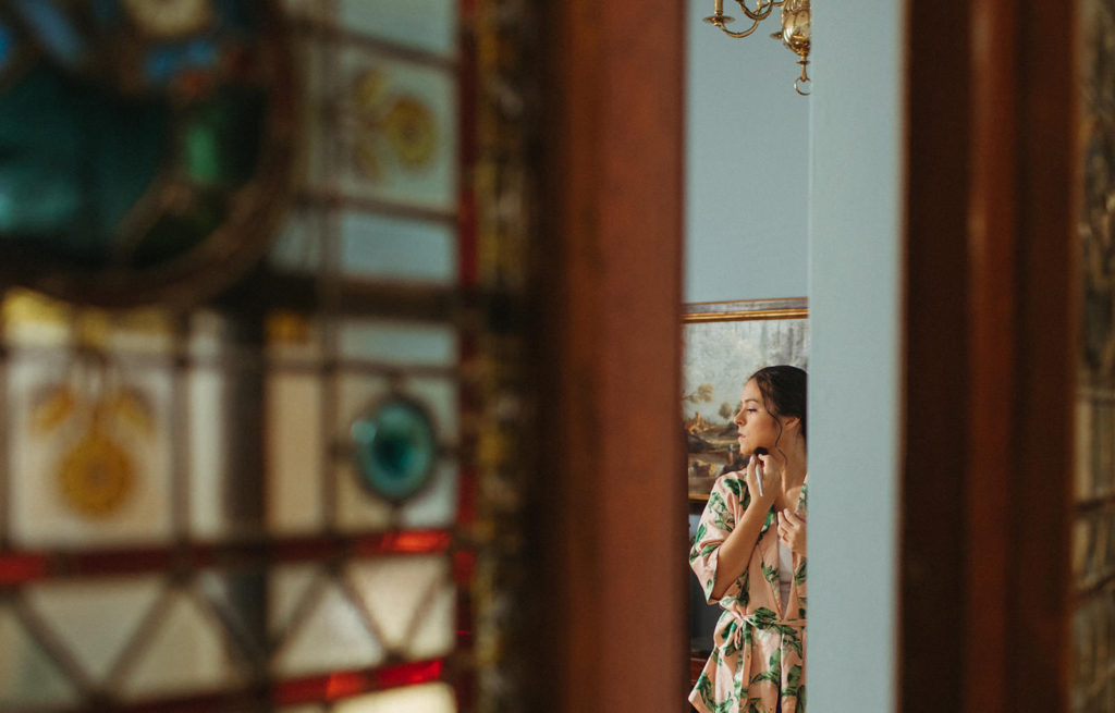 view of a bride through the door at the Glenn Memorial UMC at a small atlanta micro wedding