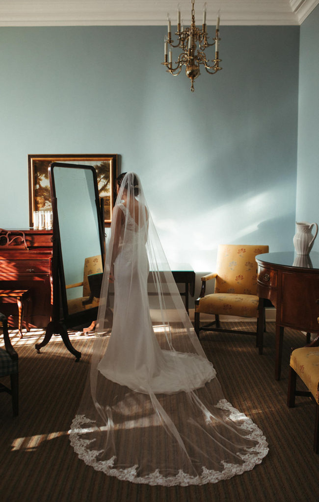 bride looking in the mirror before a small wedding ceremony in atlanta