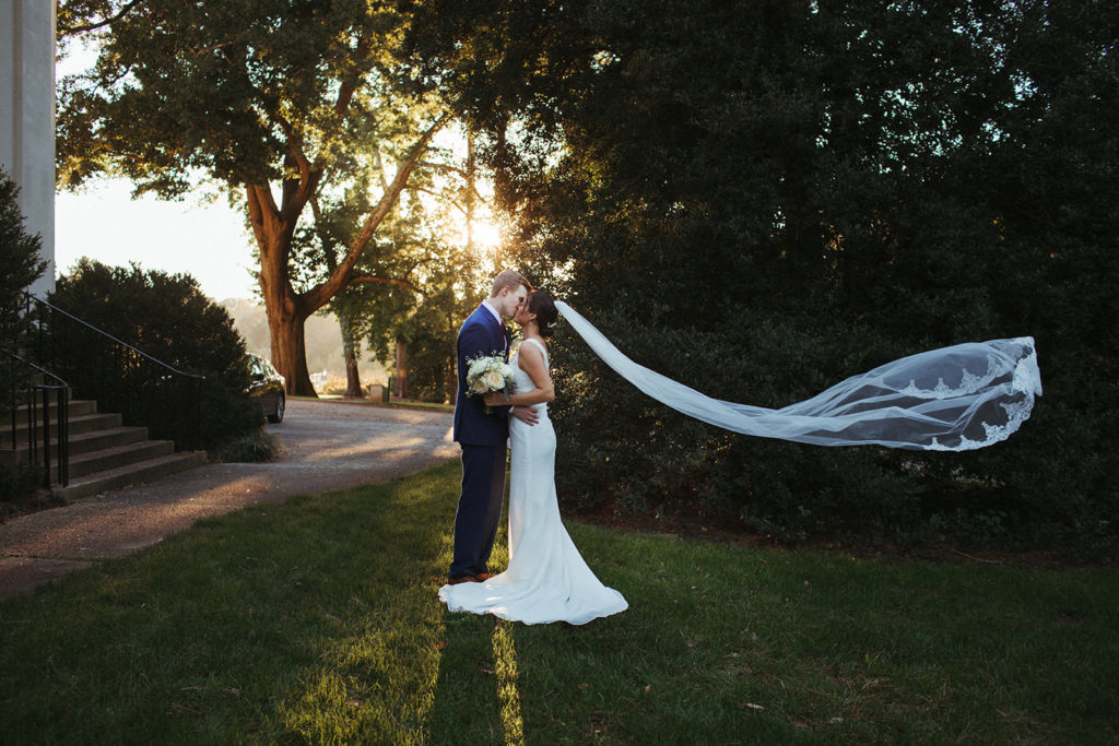 a bride and groom kiss after their small atlanta elopement