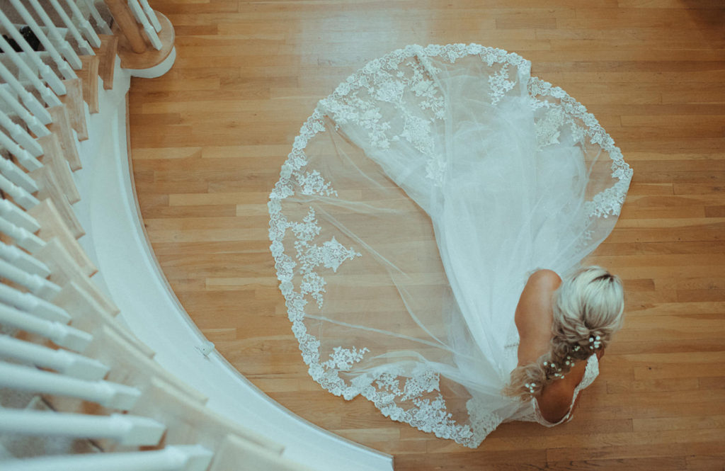 aerial shot of a bride from the top of the stairs
