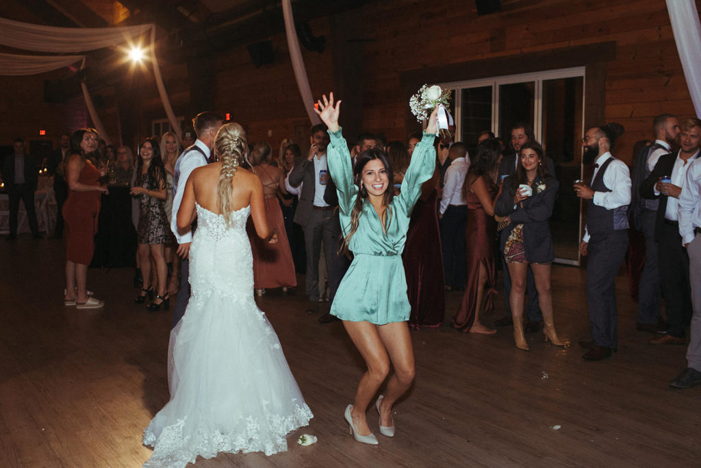 bouquet toss at Taylor Estate