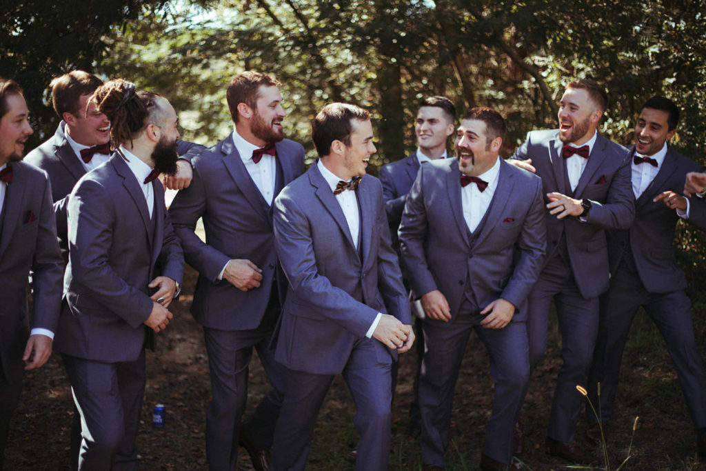 groomsmen hyping up the groom before he walks down the aisle at this estate wedding in georgia
