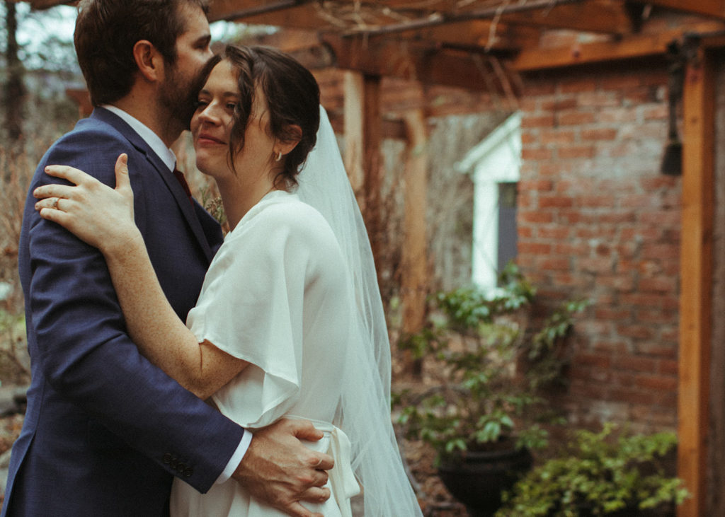 couple sharing their first dance after an intimate elopement at the ruby june inn in white salmon
