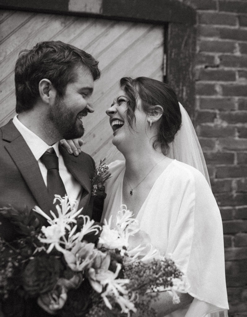 couple posing for wedding photos after an intimate elopement at the ruby june inn