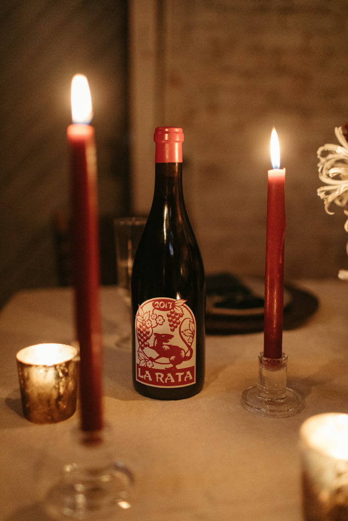 a wine bottle called La Rata on a dinner table